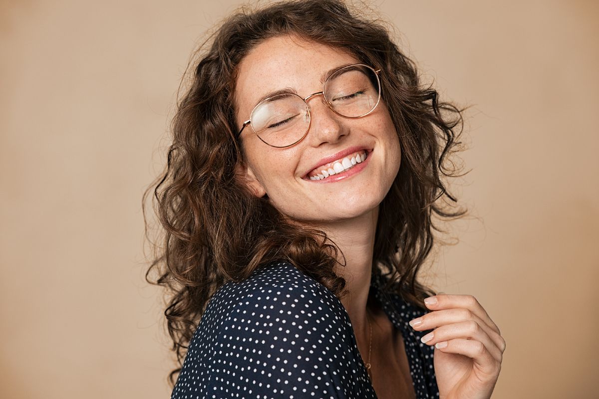 confident woman smiling with visible teeth