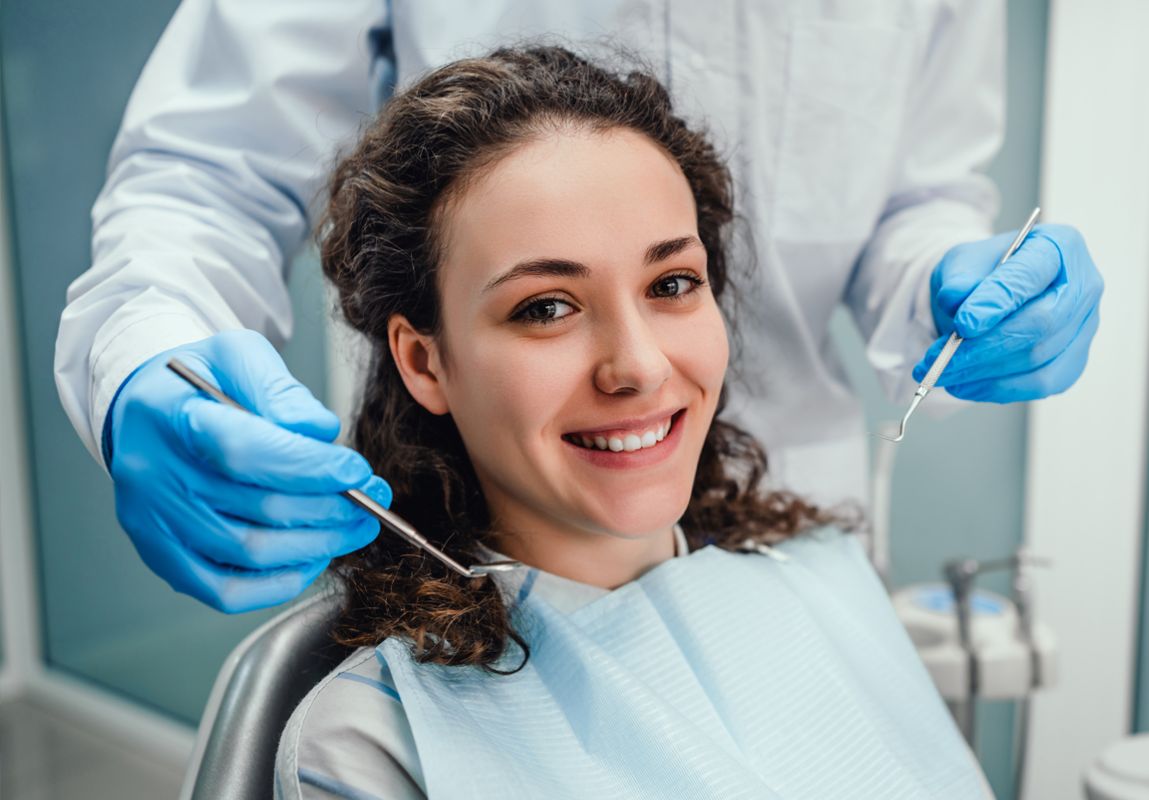 smiling patient receiving dental care in a dental office